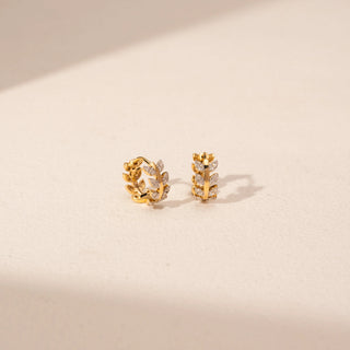 Angled view of Leaf Cluster Diamond Earrings in 14KT Yellow Gold, featuring marquise and round lab-grown diamonds.
