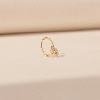 Angled view of Floral Cluster Diamond Open Hoop Nosepin in 14KT Yellow Gold, featuring a sparkling diamond cluster.