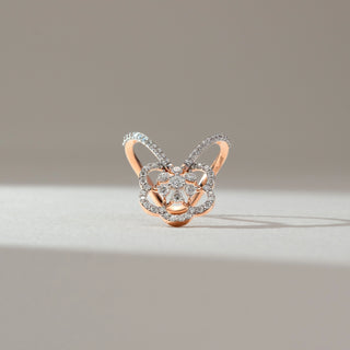 Front view of floral butterfly diamond ring in rose gold, featuring round lab-grown diamonds in a layered petal motif with diamond-studded dual bands. Set on a soft neutral backdrop, it reflects intricate elegance.