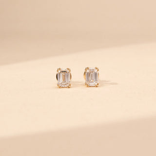 Front view of emerald-cut lab-grown diamond stud earrings in 14 KT White gold, featuring four-prong emerald-cut solitaire diamonds in a timeless minimalist design.