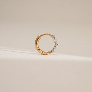 Close-up of Petal Diamond Nose Pin in 14KT Yellow Gold, featuring a circular hoop adorned with EF VVS marquise-cut diamonds arranged like petals, blending elegance and everyday charm.