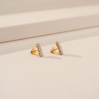 Side view of Radiant Rounded Solitaire Ring in 14KT Yellow Gold, featuring a round lab-grown diamond on a beige backdrop.