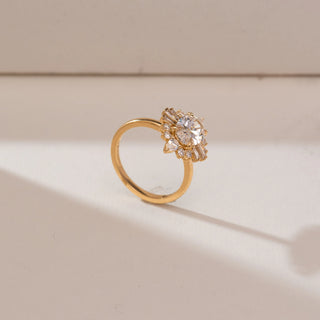 Side angle view of Oval Sunburst Deco Diamond Ring, 14KT yellow gold band featuring a central oval diamond with baguette, pear and round accents in a radiant Art Deco sunburst design.
