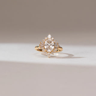 Front view of Oval Sunburst Deco Diamond Ring, 14KT yellow gold band featuring a central oval diamond with baguette, pear and round accents in a radiant Art Deco sunburst design.