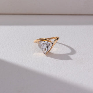 Top view of Trillion Solitaire Diamond Ring in 14KT Yellow Gold, featuring a centred trillion-cut lab grown diamond in prong setting. Set on a beige backdrop, the design highlights sculpted curves and brilliance.

