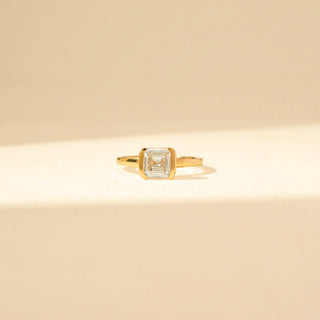 Front view of Emerald-Cut Solitaire Diamond Ring in 14KT Yellow Gold, featuring a bezel-set emerald-cut diamond.