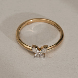 The Whispering Wings Diamond Ring in 14KT Yellow Gold, featuring marquise and round EF VVS diamonds shaped as butterfly wings, totalling 0.173 carats, on a delicate polished band.