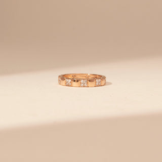Front view of a 14KT Rose Gold diamond ring with alternating polished sections and rectangular diamond-set accents.
