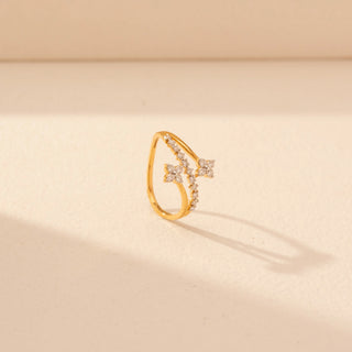 Angled view of Interlocking Floral Diamond Ring in 14KT Yellow Gold, featuring crossing bands with round diamond clusters.