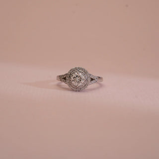 Elegant ring with gemstone on a beige background