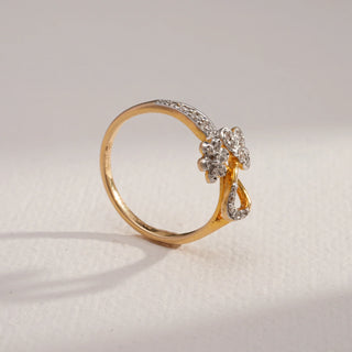 Side view of Floral Cluster Diamond Gold Ring in 14KT Yellow Gold, showcasing dual floral motifs and EF VVS round diamonds with a diamond-accented band for elegant sparkle.