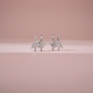 Front view of 14KT White Gold diamond drop earrings with baguette and marquise-cut diamonds.