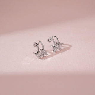 Side view of 14KT White Gold diamond drop earrings with baguette and marquise-cut diamonds.