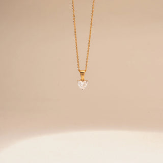 Close up view of Heart-Shaped Solitaire Diamond Pendant in 14KT Yellow Gold, featuring a heart-cut diamond on a delicate chain.