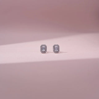 Front view of emerald-cut lab-grown diamond halo stud earrings in 14 KT white gold, featuring emerald-cut centre diamonds surrounded by octagonal pavé-set diamond halos in a timeless elegant design.