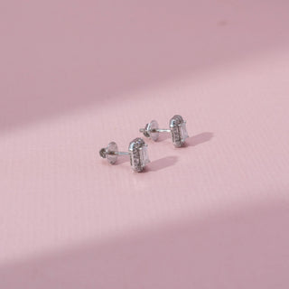 Side view of emerald-cut lab-grown diamond halo stud earrings in 18 KT yellow gold, featuring emerald-cut centre diamonds surrounded by octagonal pavé-set diamond halos in a timeless elegant design.