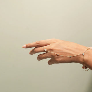 Side view of Floral Diamond Hand Chain in 14KT Yellow Gold, featuring floral diamond motifs linking the ring and bracelet.