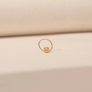 Front view of Floral Diamond Nosepin in 14KT Yellow Gold, featuring a floral motif and centred diamond.