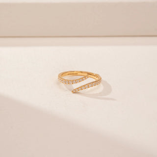 Top view of a 14KT Yellow Gold diamond ring, featuring round diamonds on two curved open bands.
