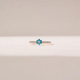 Front view of Blue Floral Gemstone Ring in 14KT Rose Gold, featuring blue round gemstones and round lab-grown diamonds.