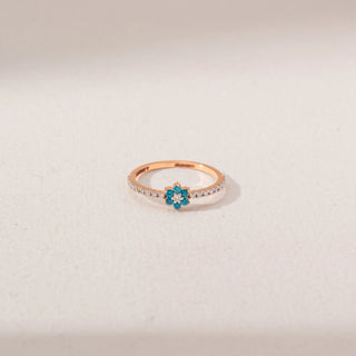 Top view of Blue Floral Gemstone Ring in 14KT Rose Gold, featuring blue round gemstones and round lab-grown diamonds.