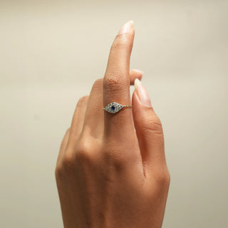 Side view of Azure Eye Diamond Ring in 14KT Yellow Gold, featuring a blue centre diamond surrounded by round lab-grown diamonds.