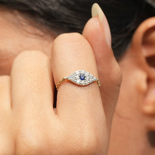 Close-up view of Azure Eye Diamond Ring in 14KT Yellow Gold, featuring a blue centre diamond and round lab-grown diamonds.