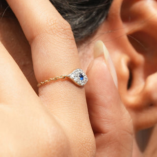 Close-up side view of Azure Eye Diamond Ring in 14KT Yellow Gold, featuring a blue centre diamond and round lab-grown diamonds.