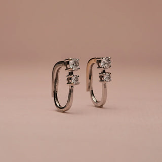 Close-angle view of 18KT White Gold Modern Diamond Hoop Drop Earrings with two EF VVS round brilliant diamonds each, designed in a sleek hoop-drop style for modern minimalist elegance.