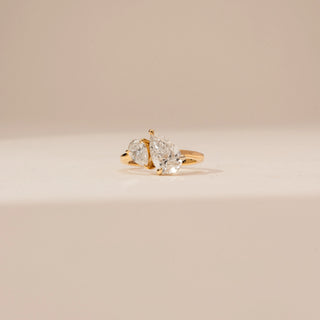 Front view of Dazzling Pear Bypass Diamond Ring in 14KT Yellow Gold, featuring two pear-cut lab-grown diamonds.
