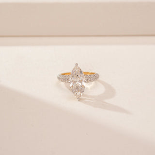 Front view of a 14KT Yellow Gold diamond ring, featuring two marquise-cut diamonds and a diamond-set band.