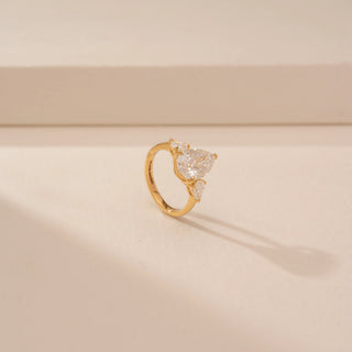 Angled view of Royal Pear Floral Diamond Ring in 14KT Yellow Gold, featuring pear-cut lab-grown diamonds in a floral design.