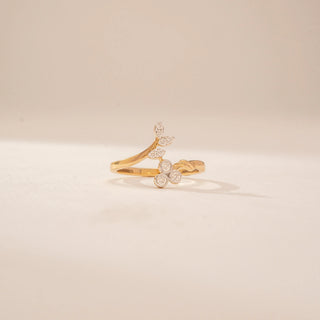 Front view of a 14KT Yellow Gold diamond ring, featuring marquise and round diamonds in a floral design.