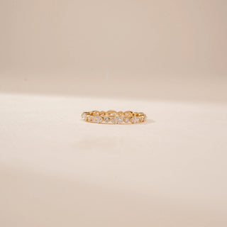 Front view of a 14KT Yellow Gold diamond band with alternating round and oval diamonds in a linked design.