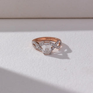 Top view of Emerald Cut Halo Diamond Ring in 14KT Rose Gold, featuring a centred emerald-cut lab grown diamond with halo accents. Set on a beige backdrop, the design highlights refined brilliance and elegance.
