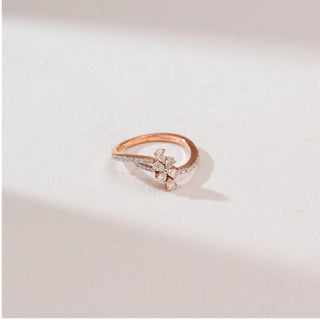 Top view of Rose Gold Blossom Diamond Ring in 14KT rose gold, featuring a five pear-shaped diamond flower and a curved pavé diamond bypass band.