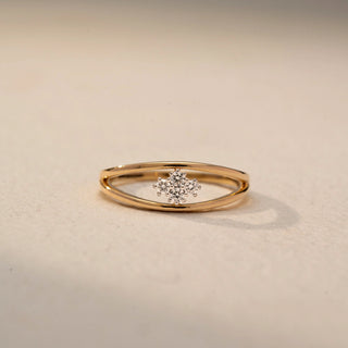 Front view of a Trio Diamond Cluster Ring in 14KT Yellow Gold, featuring three round lab-grown diamonds in a floral cluster on a slim band. Captured against a beige backdrop, highlighting delicate sparkle.