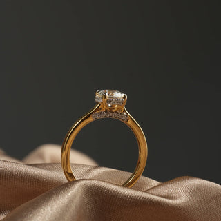 Side view of this female ring of size 12, worn by a model, features a brilliant 0.86-carat lab-grown diamond set in 14 KT yellow gold weighing a total of 2.89 grams. The solitaire diamond is the centrepiece, showcasing its brilliance and timeless elegance. In this side view, the ring's exquisite design and sparkling diamond are highlighted, emphasizing its classic luxury and refined sophistication.