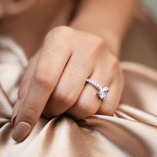 Top view of a 1.188-carat Lab Grown Diamond female Ring in 14 KT white gold weighing a total of 3.34 grams of size 12. The ring is elegantly displayed on a model's hand, offering a top-view perspective. The central round brilliant diamond is prominently featured, surrounded by smaller diamonds along the pave band, which adds extra sparkle and sophistication to the design.