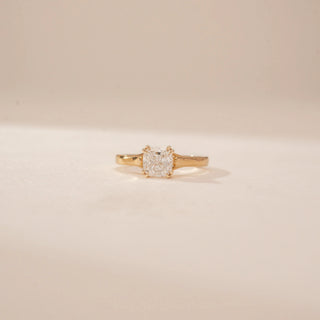 Front view of a 14KT Yellow Gold diamond ring with a square centre diamond and plain tapered band.