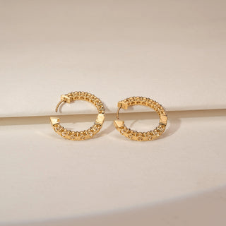 Top view of 14KT Yellow Gold diamond earrings, featuring vertical rows of round diamonds in slim settings.