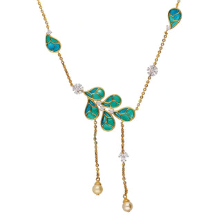 On a white background. a close-up front view of a female necklace secured with a spring lock of size 16, crafted with 14 KT Gold and 0.74 Carat the weight of the product is 9.205 grams, featuring a leaf-shaped pattern made of yellow gold and inlaid with vibrant teal-coloured gemstones. The pendants are strung along a delicate yellow-gold chain interspersed with small lab-grown diamonds. The necklace has a nature-inspired, elegant floral design that would complement many outfits.