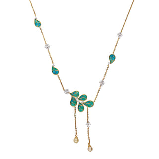 On a white background. a  front view of a female necklace secured with a spring lock of size 16, crafted with 14 KT Gold and 0.74 Carat and the weight of the product is 9.205 grams, featuring a leaf-shaped pattern made of yellow gold and inlaid with vibrant teal-coloured gemstones. The pendants are strung along a delicate yellow-gold chain interspersed with small lab-grown diamonds. The necklace has a nature-inspired, elegant floral design that would complement many outfits.