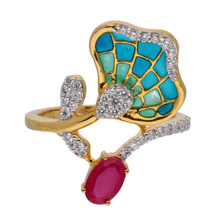 Front view of a female ring on a white background of size 12, featuring a pink gemstone accented by smaller round diamonds. The centrepiece is a vibrant ruby complemented by an ornate green gemstone motif, arranged in a floral or leaf design. The lab-grown diamond ring band is crafted from 14 KT yellow gold metalwork and 0.26 carats and the weight of the product is 3.38 grams.