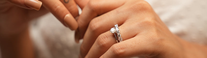 Close-up of Reia lab grown diamonds engagement ring on hand, sustainable luxury diamond jewelry with timeless sparkle.