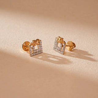 Geometric stud earrings with an open square design outlined in small diamonds, topped with a sculpted gold knot detail for a modern and structured look.