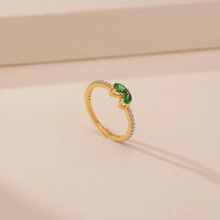 Angled view of Elegant Emerald Duo Diamond Ring in 14KT Yellow Gold, featuring green emeralds and round lab-grown diamonds.