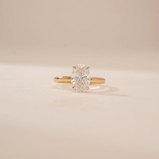 Front view of a 14KT Yellow Gold diamond ring, featuring an oval-cut centre diamond and a plain gold band.