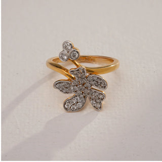 Close-up top view of Floral Bloom Diamond Gold Ring in 14KT Yellow Gold, featuring a blooming flower design with EF VVS round diamonds and a three-stone accent.