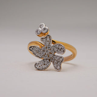 Close-up of Floral Bloom Diamond Gold Ring in 14KT Yellow Gold with EF VVS round diamonds, floral motif and three-stone accent, symbolising elegance and feminine charm.